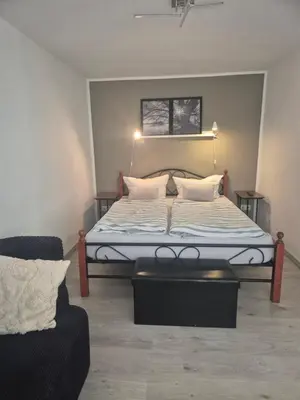 Ein Bett oder Betten in einem Zimmer der Unterkunft Puppenstube mir 2 Zimmer anstatt 3 Zimmer