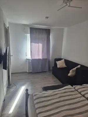 Ein Bett oder Betten in einem Zimmer der Unterkunft Puppenstube mir 2 Zimmer anstatt 3 Zimmer