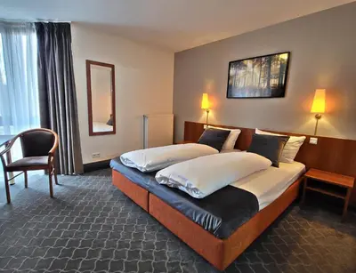 Ein Bett oder Betten in einem Zimmer der Unterkunft Concorde Hotel Ascot