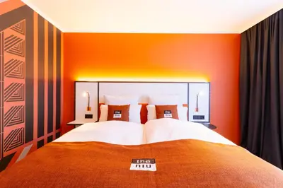 Ein Bett oder Betten in einem Zimmer der Unterkunft Holiday Inn - the niu, Blade Solingen by IHG