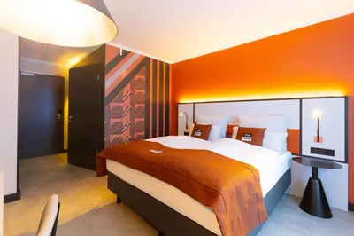 Ein Bett oder Betten in einem Zimmer der Unterkunft Holiday Inn - the niu, Blade Solingen by IHG