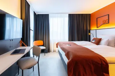 Ein Bett oder Betten in einem Zimmer der Unterkunft Holiday Inn - the niu, Blade Solingen by IHG