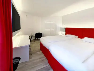 Ein Bett oder Betten in einem Zimmer der Unterkunft DORMERO Hotel Düsseldorf