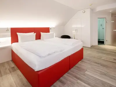 Ein Bett oder Betten in einem Zimmer der Unterkunft DORMERO Hotel Düsseldorf