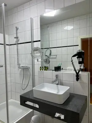 Ein Badezimmer in der Unterkunft Stadthotel Reckers