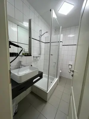 Ein Badezimmer in der Unterkunft Stadthotel Reckers