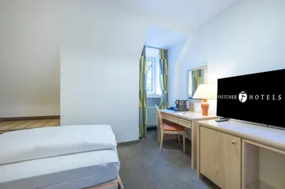 Ein Bett oder Betten in einem Zimmer der Unterkunft Fletcher Waldhotel Nordrhein-Westfalen