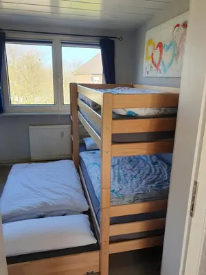 Ein Bett oder Betten in einem Zimmer der Unterkunft Ferienwohnung am Stadion Bochum Grumme