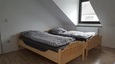Ein Bett oder Betten in einem Zimmer der Unterkunft Ferienwohnung in Essen