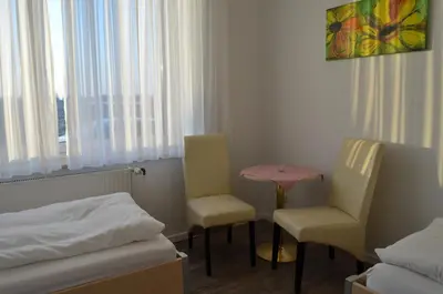 Ein Bett oder Betten in einem Zimmer der Unterkunft Hotel Alter Giebel