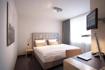 Ein Bett oder Betten in einem Zimmer der Unterkunft Hotel Maximilians