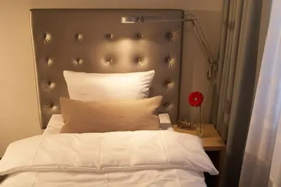 Ein Bett oder Betten in einem Zimmer der Unterkunft Hotel Maximilians