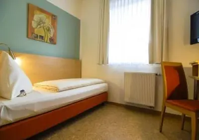 Ein Bett oder Betten in einem Zimmer der Unterkunft Hotel Petul An der Zeche