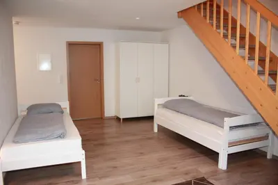 Ein Bett oder Betten in einem Zimmer der Unterkunft Ferienwohnung Mülheim Heißen mit großem Balkon