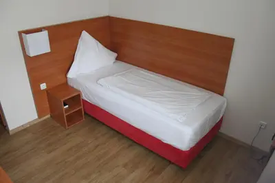 Ein Bett oder Betten in einem Zimmer der Unterkunft Stadt-Gut-Hotel Zum Rathaus