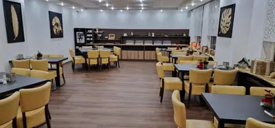 Ein Restaurant oder anderes Speiselokal in der Unterkunft Stadt-Gut-Hotel Zum Rathaus