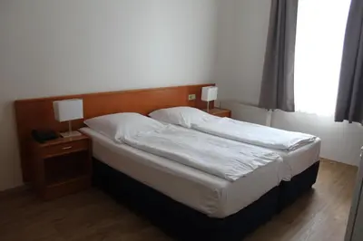 Ein Bett oder Betten in einem Zimmer der Unterkunft Stadt-Gut-Hotel Zum Rathaus