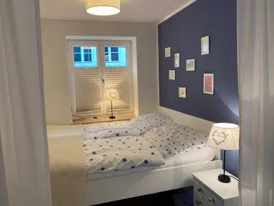 Ein Bett oder Betten in einem Zimmer der Unterkunft Ferienwohnung Wülfrath