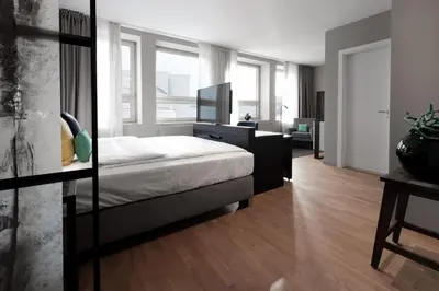 Ein Bett oder Betten in einem Zimmer der Unterkunft SAXX Hotel 