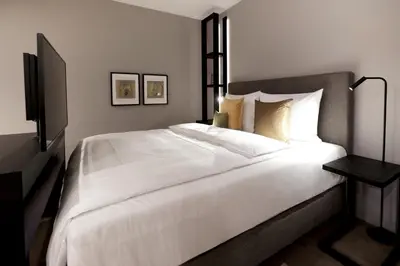 Ein Bett oder Betten in einem Zimmer der Unterkunft SAXX Hotel 
