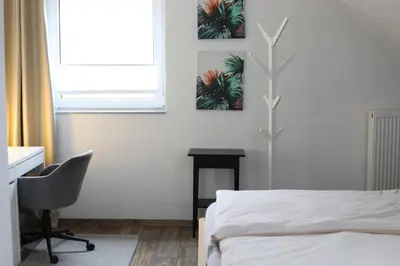 Ein Bett oder Betten in einem Zimmer der Unterkunft Moderne Wohnung in Krefeld