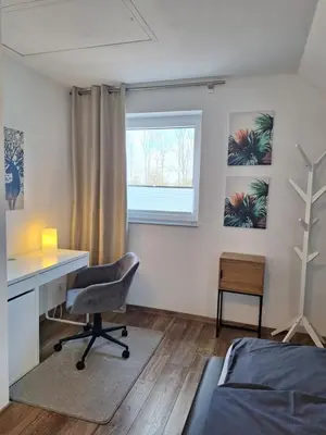 Ein Bett oder Betten in einem Zimmer der Unterkunft Moderne Wohnung in Krefeld