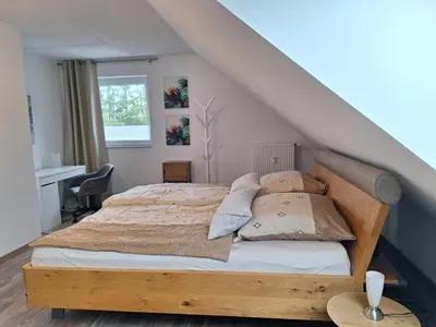 Ein Bett oder Betten in einem Zimmer der Unterkunft Moderne Wohnung in Krefeld