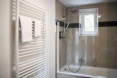Ein Badezimmer in der Unterkunft JUNIK Apartments im Stadtzentrum