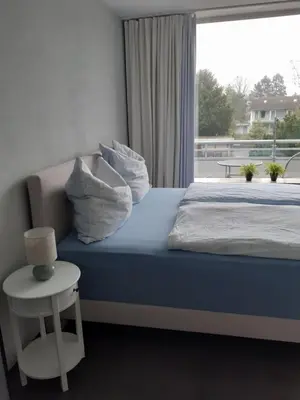 Ein Bett oder Betten in einem Zimmer der Unterkunft Apartment am Park