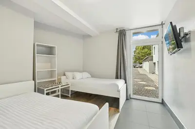 Ein Bett oder Betten in einem Zimmer der Unterkunft Hotel Engelsburg - Apartments - Ferienwohnungen