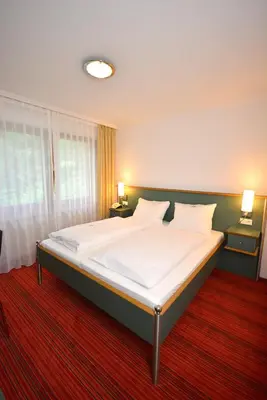 Ein Bett oder Betten in einem Zimmer der Unterkunft Hotel Kehrenkamp