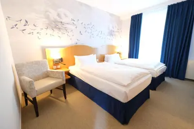 Ein Bett oder Betten in einem Zimmer der Unterkunft Hotel Das Lola