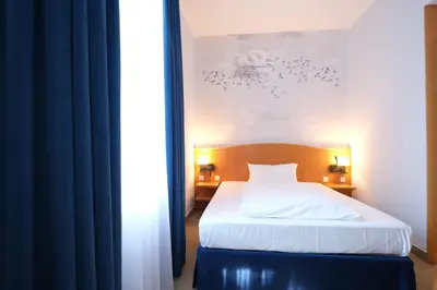 Ein Bett oder Betten in einem Zimmer der Unterkunft Hotel Das Lola