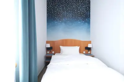 Ein Bett oder Betten in einem Zimmer der Unterkunft Hotel Das Lola