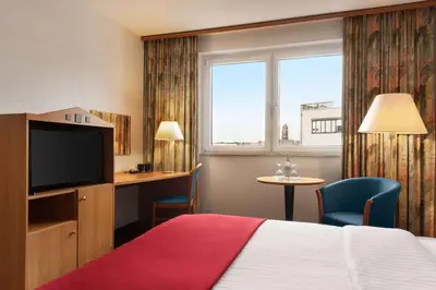 Ein Bett oder Betten in einem Zimmer der Unterkunft Ramada by Wyndham Bottrop City