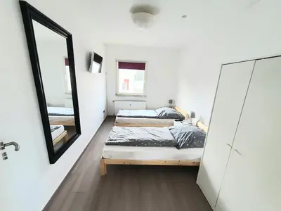 Ein Bett oder Betten in einem Zimmer der Unterkunft Pottmensch Oberhausen 3 Schlafzimmer