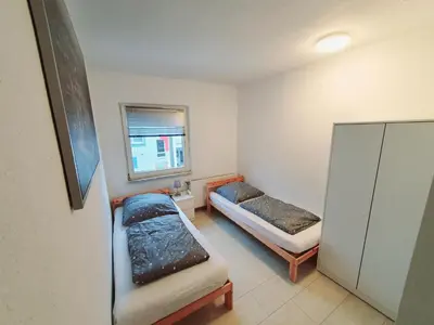 Ein Bett oder Betten in einem Zimmer der Unterkunft Pottmensch Oberhausen 3 Schlafzimmer