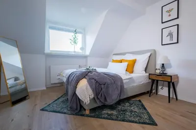 Ein Bett oder Betten in einem Zimmer der Unterkunft cruwzo I Apartments am Uniklinikum