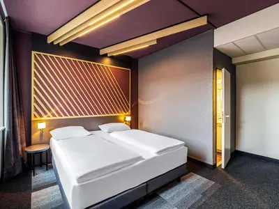 Ein Bett oder Betten in einem Zimmer der Unterkunft B&B Hotel Duisburg Hbf-Nord
