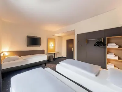Ein Bett oder Betten in einem Zimmer der Unterkunft B&B Hotel Duisburg Hbf-Nord