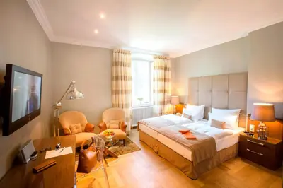 Ein Bett oder Betten in einem Zimmer der Unterkunft Schlosshotel Hugenpoet