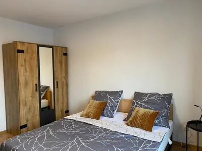 Ein Bett oder Betten in einem Zimmer der Unterkunft Moderne Wohnung bei Duisburg Hbf.