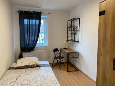 Ein Bett oder Betten in einem Zimmer der Unterkunft Moderne Wohnung bei Duisburg Hbf.