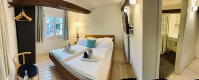 Ein Bett oder Betten in einem Zimmer der Unterkunft Kötterhof Hotel