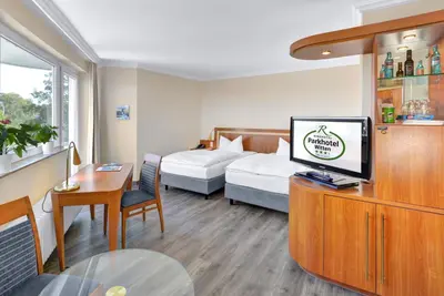 Ein Bett oder Betten in einem Zimmer der Unterkunft Ringhotel Parkhotel Witten