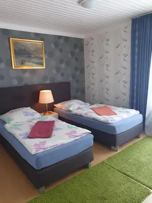 Ein Bett oder Betten in einem Zimmer der Unterkunft Ferienwohnungen lemberg