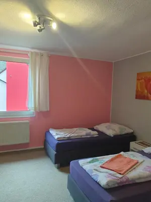 Ein Bett oder Betten in einem Zimmer der Unterkunft Ferienwohnungen lemberg