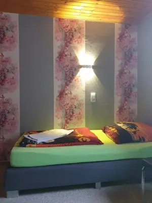 Ein Bett oder Betten in einem Zimmer der Unterkunft Ferienwohnungen lemberg