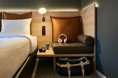 Ein Bett oder Betten in einem Zimmer der Unterkunft Moxy Essen City