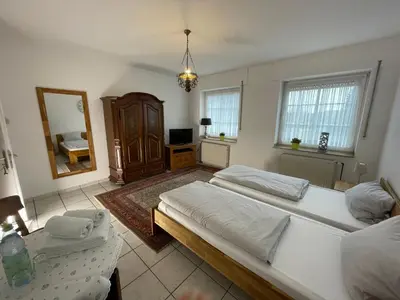 Ein Bett oder Betten in einem Zimmer der Unterkunft Landhaus Holthausen